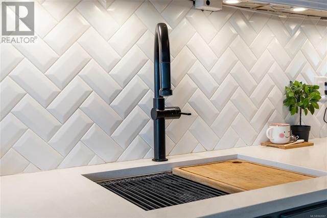 Custom herringbone   beveled tiled kitchen | Image 8