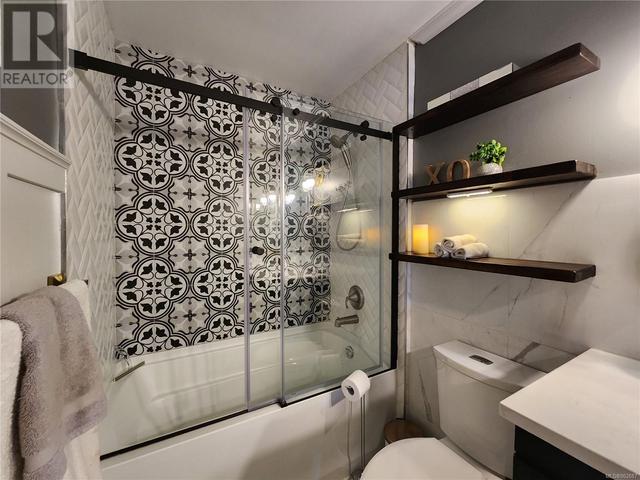 Custom herringbone Tile and tile feature wall with modern glass shower doors | Image 35