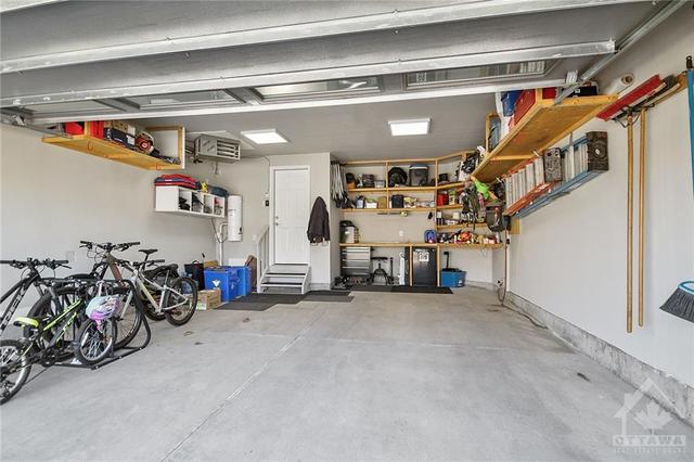 Heated garage will plenty of storage | Image 30