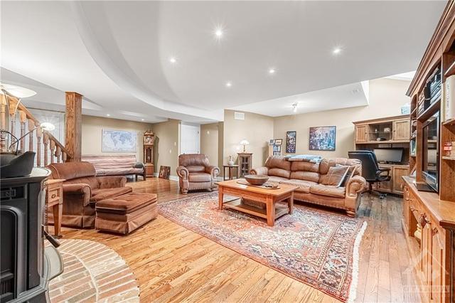 Basement has 9' Ceilings and Hardwood throughout - Large Family Room with Pellet Stove and Skylight Windows for Natural Light | Image 19