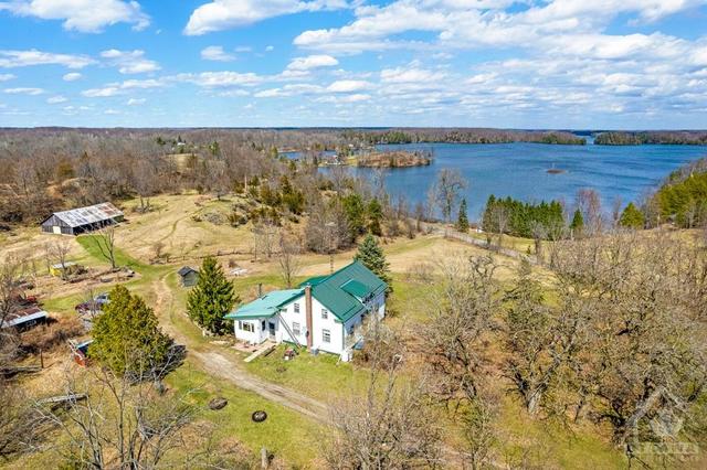 Century home with 275 acres in Green Bay on Bobs Lake | Image 1