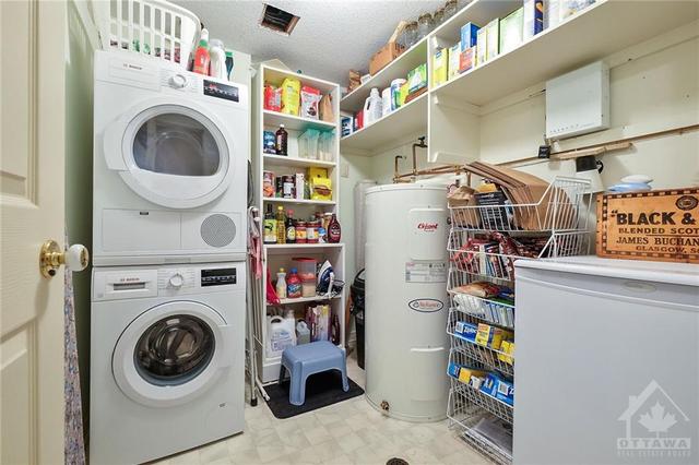 Laundry room with shelving. | Image 17