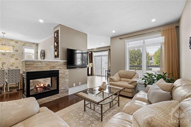 Living Room w double-sided fireplace | Image 8