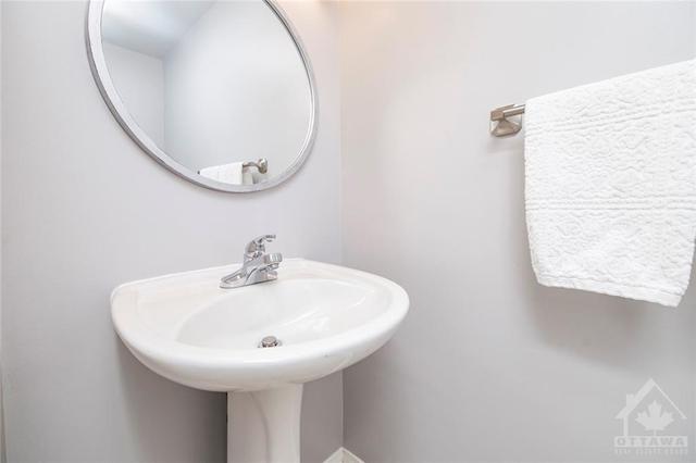 Conveniently located powder room next to your foyer! | Image 12