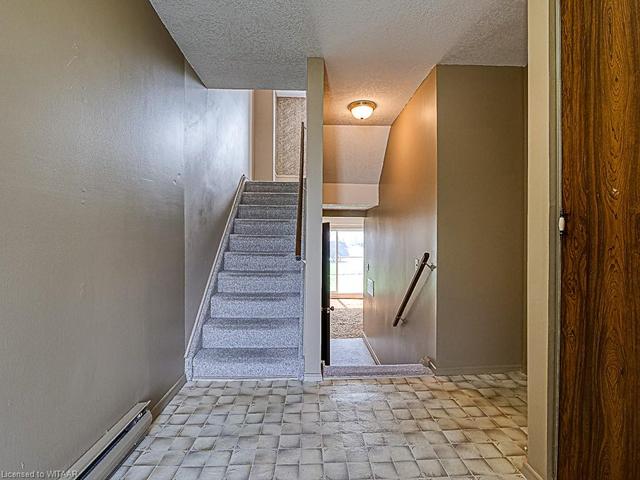 Foyer with entrance to main level rec room, 2pc bath & converted garage | Image 38