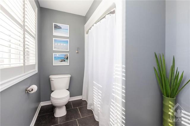Bright full bathroom completes the upper level | Image 15