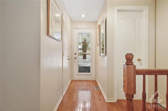 Welcoming foyer adorned with hardwood floors that extend through the main level. | Image 3