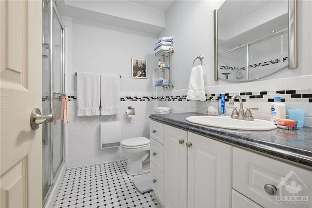 Main Bathroom with a large walk in shower. | Image 15