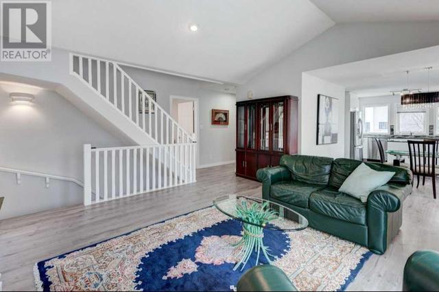 The stairs lead to the upper loft and down to the lower level | Image 14