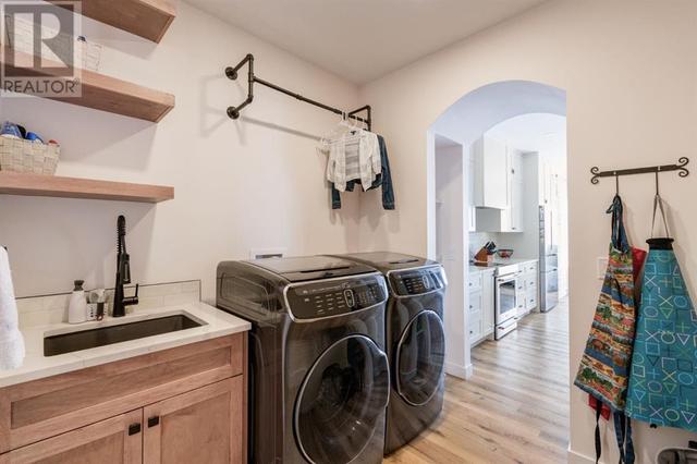 Convenient Laundry Room with Sink | Image 16
