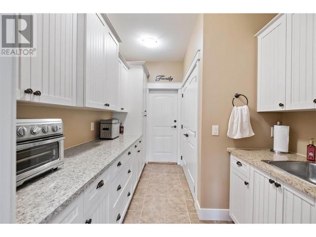 1297 Tanemura Crescent, House detached with 4 bedrooms, 4 bathrooms and 3 parking in Kelowna BC | Image 20