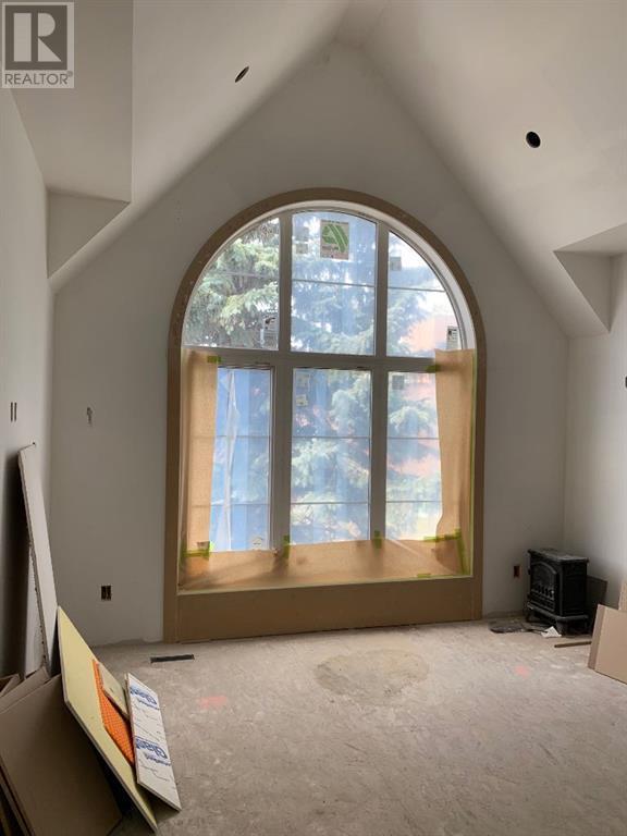 Arch Window in Primary Bedroom (in 2614 31 St SW) | Image 24