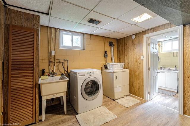 Lower level laundry room. This room also has an access to a large crawl space for lots of extra storage | Image 22