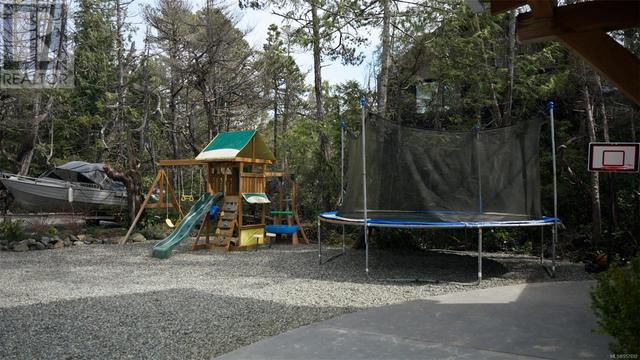 Front yard play park - note ample parking for boats, RV's, and toys of all shapes, sizes and kinds for young and mature alike. | Image 75