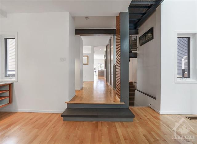 View from Livingroom through house to dining room/kitchen/familyroom and out to garden. Great sight lines. | Image 10