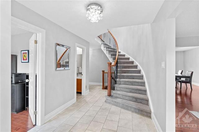 Gorgeous curved staircase and spacious entry way. | Image 5