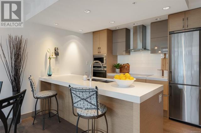Streamline kitchen with room for bar stools under the counter | Image 7