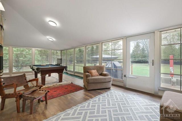 Three season sunroom currently set up as Games Room with pool table & bar included. | Image 13