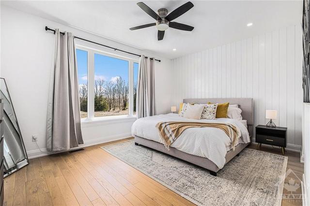 The big bright master bedroom with a view!  This room has a walk in closet as well as a his closet for all the t-shirts  LOL. | Image 8