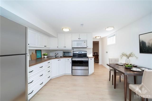 Virtually staged in law suite/2nd kitchen | Image 24