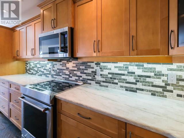 Kitchen - Maple cabinets and quartzite countertops | Image 14