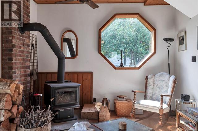 woodstove on brick hearth, keeps the home cozy | Image 33
