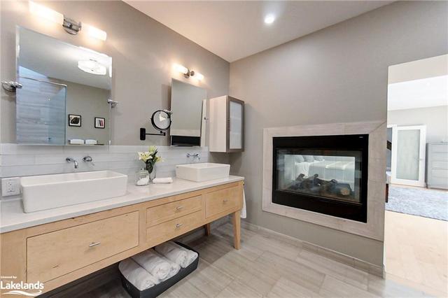 Double Sinks & 2-sided Gas Fireplace in the Primary Ensuite | Image 13
