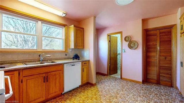 Kitchen view with pantry and 2 piece bath #3 | Image 16