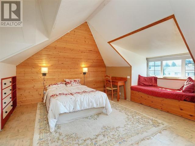 Attic bedroom with cute sitting area over looking the garden area | Image 17