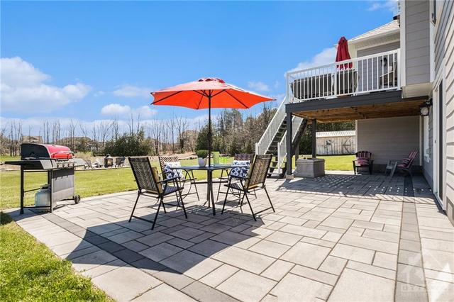 This 35 by 20 foot patio is just an awesome buffer to have between your lawn and the inside of your home. Also what an awesome play area for small kids or teens being teens. | Image 22