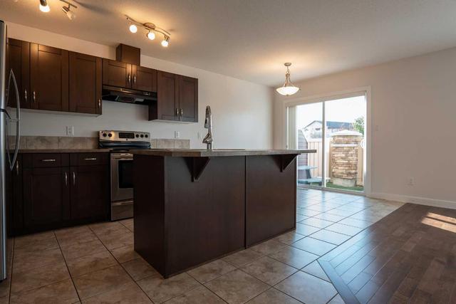 1 - 213 Silkstone Rd W, Home with 3 bedrooms, 2 bathrooms and 2 parking in Lethbridge AB | Image 11