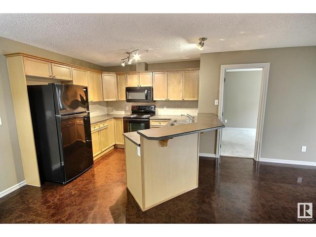 114 - 13710 150 Ave Nw, Condo with 2 bedrooms, 2 bathrooms and null parking in Edmonton AB | Image 2