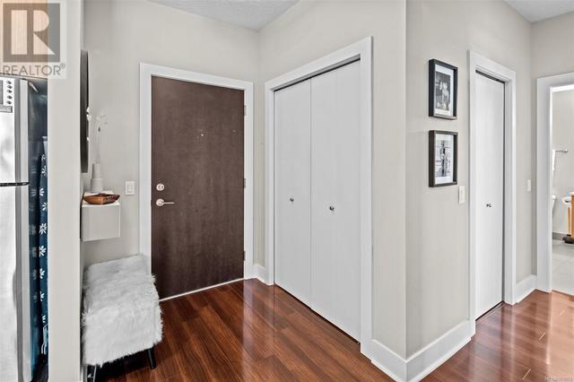 Entry way with additional storage space behind the closet and laundry | Image 14