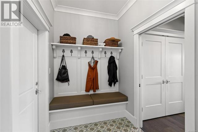 Separate mudroom from garage complete with hidden storage sitting bench | Image 23