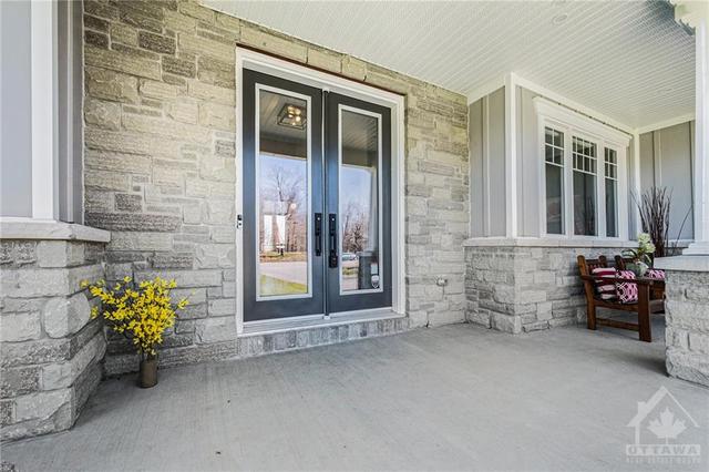 The only thing better than a covered porch in the summer is a covered porch in the winter. It’s also concrete so it will never need to be maintained or replaced. | Image 2