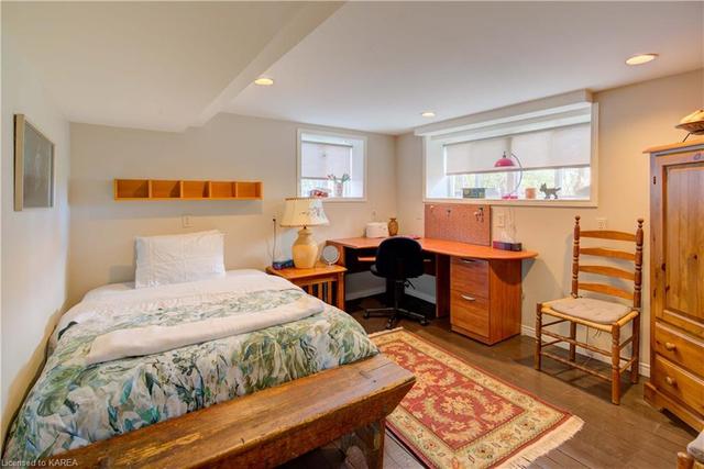 The pretty primary bedroom is right off the dining room. | Image 14