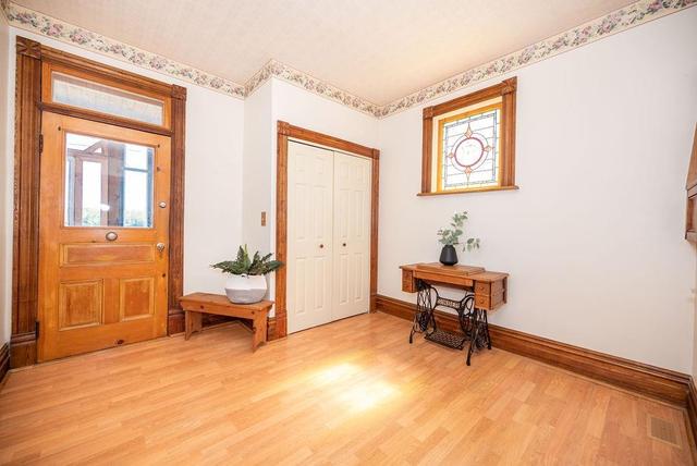 Larger foyer. Beautiful wood trim. So much character including original hardware on most doors. | Image 10