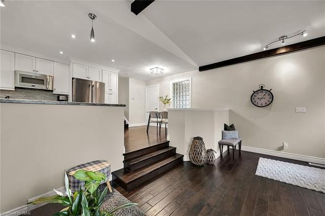 Separate living spaces  by the door to the basement | Image 2