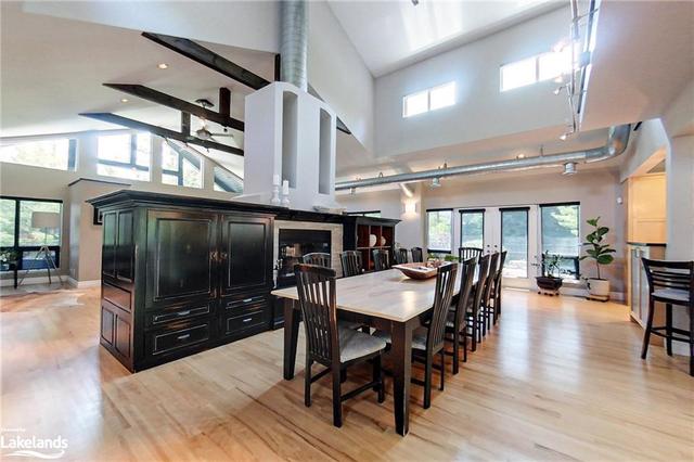 2 Story Dining Room with a 2-sided Wood Fireplace | Image 3