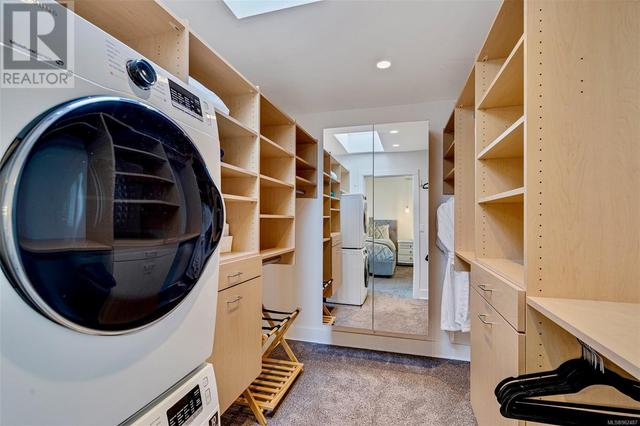 Primary Bedroom Walk-in Closet with Laundry | Image 23