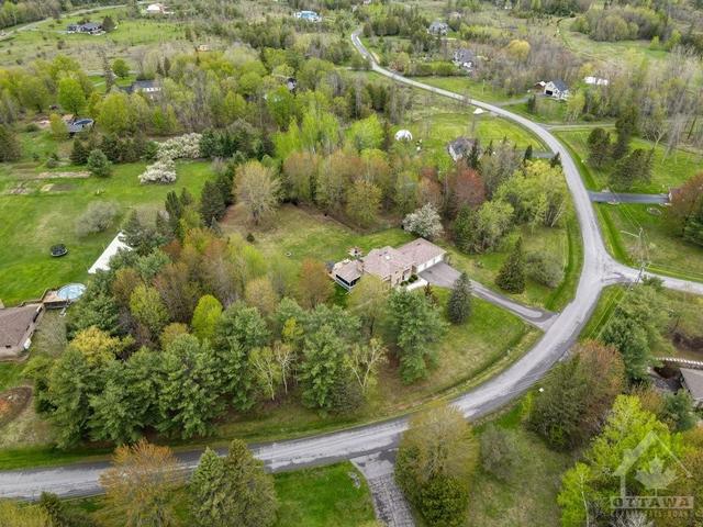 Aerial view captures the privacy of this large estate property | Image 27