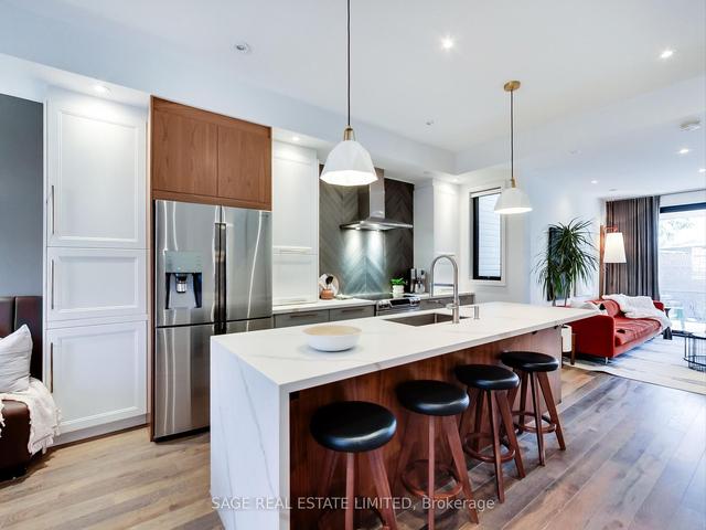 148 De Grassi St, House attached with 2 bedrooms, 2 bathrooms and 0 parking in Toronto ON | Image 1
