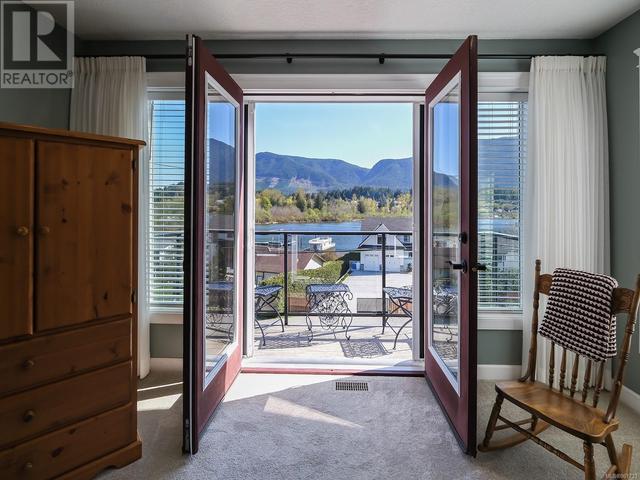 Primary bedroom private deck with views over valley and lake | Image 30