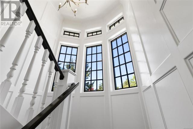 Grand wood staired Turret staircase accessing both upper and lower levels | Image 27