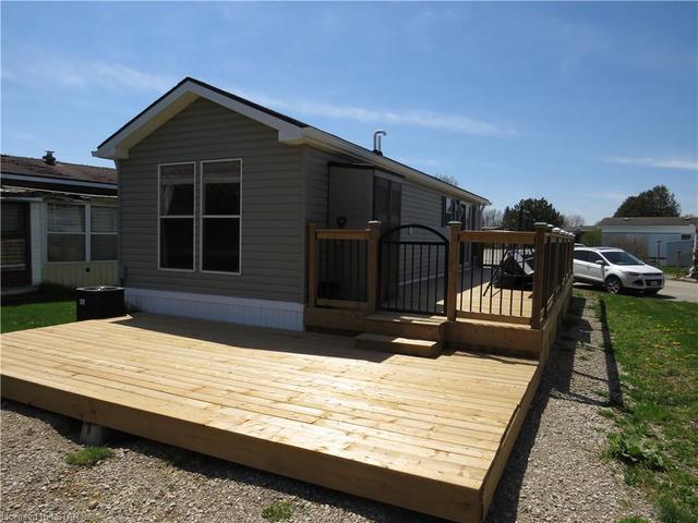 22' back deck steps up to gate and railing around side deck,  Air Conditioner on back corner | Image 21