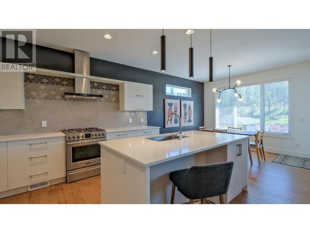 127 Split Pine Crt, House detached with 4 bedrooms, 3 bathrooms and 2 parking in Kelowna BC | Image 4