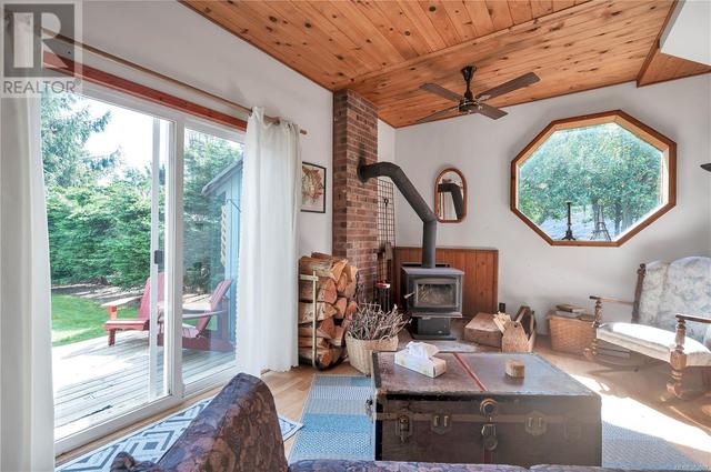 living room, woodstove on brick hearth | Image 32