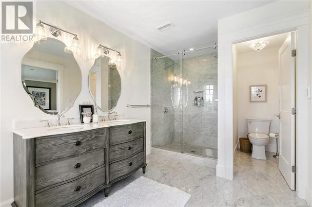 Custom twin sink vanity, 2 person shower & separate water closet all with heated floors | Image 36