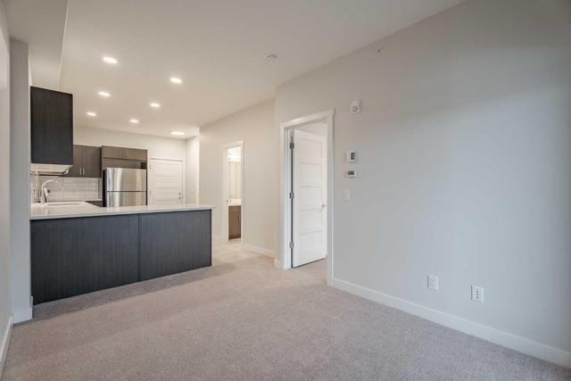 410 - 55 Wolf Hollow Crescent Se, Condo with 1 bedrooms, 1 bathrooms and 1 parking in Calgary AB | Image 4