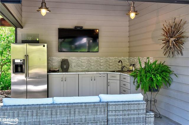 Covered Casual Lounge & TV Area in the Cabana | Image 35